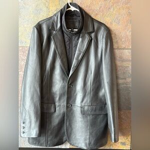 Black leather sport coat with zipper inner warmer on front. Is removable, 42R,